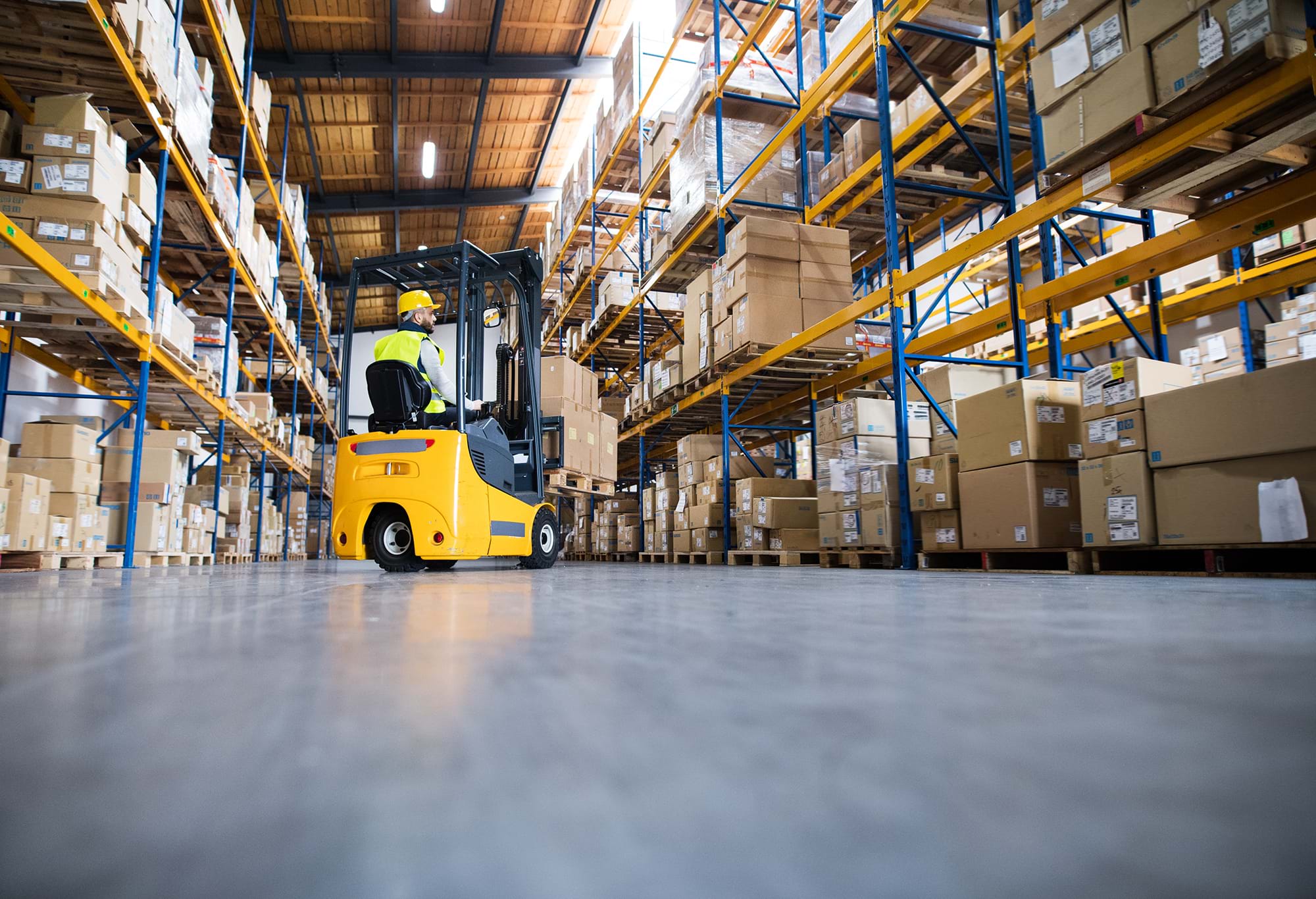 Forklift truck in operation in warehouse